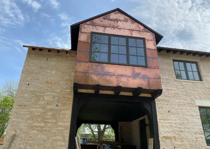 Copper metal panel facade on a stone building for Roof Repair in Rancho Cordova